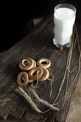 Breakfast with fresh milk and bagels. Milk and Bagels. Spikelets of dry wheat.