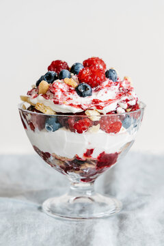 Trifle with vanilla shortbread, cream, meringue, raspberries and blueberries