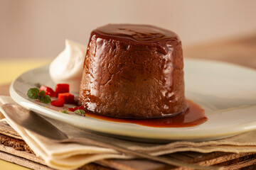 Chocolate dessert with caramel an strawberries