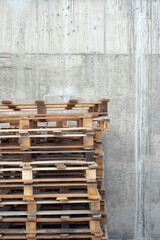 Stack Of Pallets Against Concrete Wall