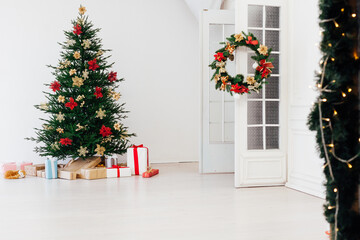 decorated room with Christmas tree with presents under it