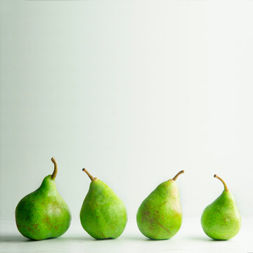 Four organic pears in a raw