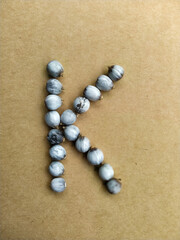 Seeds of Job's tears, scientific name Coix lacryma-jobi, arranged in a 