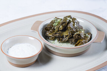 Macro Photo of Traditional Turkish Dolma, Sarma or Dolmades on White Plate.