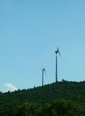 Large wind turbines to generate electricity on a field in Germany. - 395604863