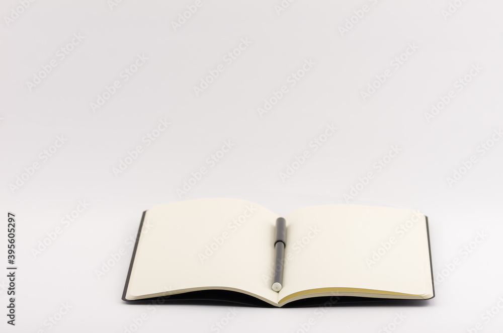 Poster closeup shot of an open blank book with highlighter isolated on a white background