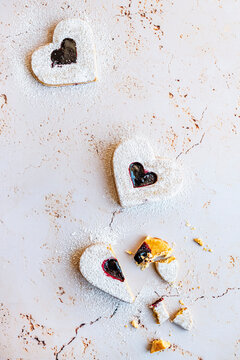 Heart shaped cookies with raspberry jam (and a broken heart)