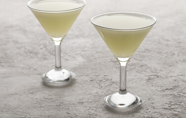 Two glasses of natural whey on a bright background