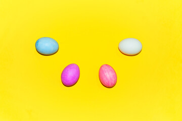 Colorful  eggs on yellow background.