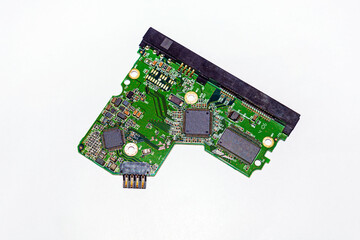 Hard disk drive motherboard on white background.