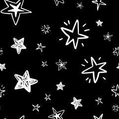 Obraz premium hand drawn stars seamless pattern. Doodle star texture. Sky and night background.