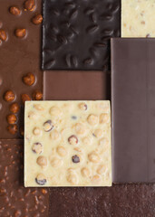 Many various chocolate bars and nuts