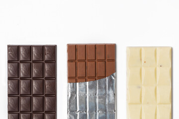 Many various chocolate bars and nuts