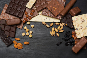 Many various chocolate bars and nuts