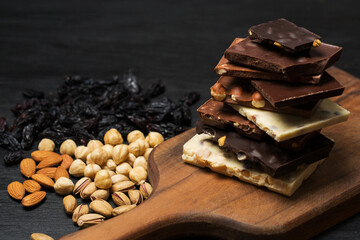 Many various chocolate bars and nuts