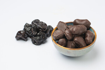 Dried plums covered with chocolate