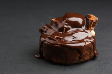 Melted chocolate close up on a grey background