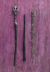 warlock magic wand, old purple wood background