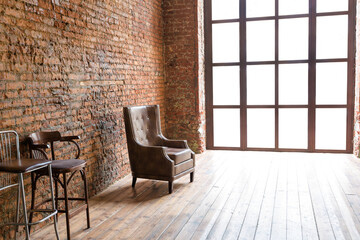 Interior design in loft style of spacious empty room with a huge windows