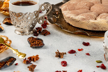 Turkish pastries and scattered dry fruits on table
