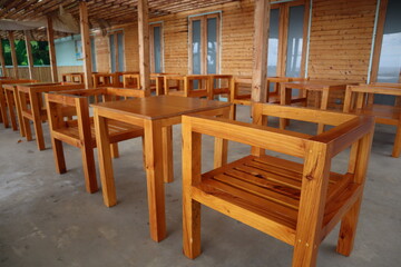 empty bar with geometrical wooden chairs, at Ponta Do Sol, Madeira