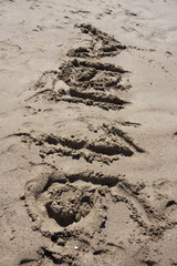high school graduation 2016 lettering in the sand on the beach
