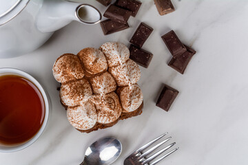 Mini chocolate cake with a cup of tea.