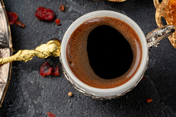 Cup of turkish coffee and dry fruits on table