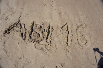 high school graduation 2016 lettering in the sand on the beach
