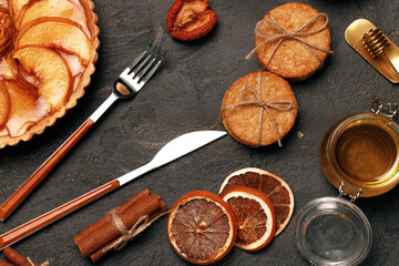 Apple tart pie on black surface close up