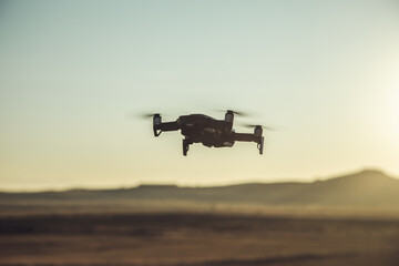 Flying drone over the field