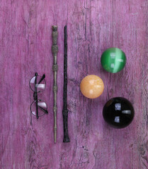 warlock magic wand, old purple wood background