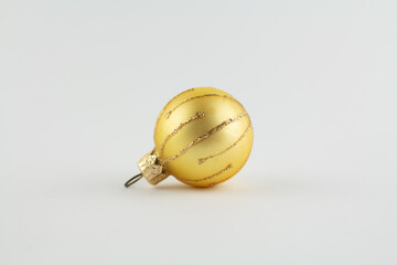 golden ball for christmas tree on white background