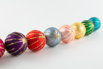 multicolored Christmas toys on a white background