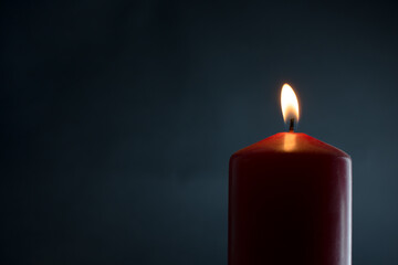 Candle light in a dark room. Selective focus and vignetting. 