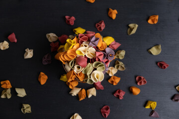 Colorful Italian pasta on a wooden rustic background. 