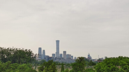 Fototapeta na wymiar Beijing Dontown (CBD) and China Zun. Skyscrapers and trees Asia