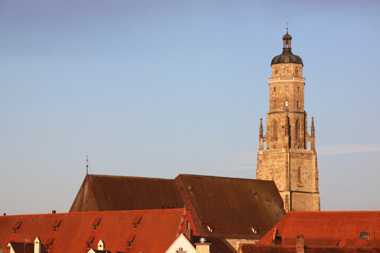 Medieval skyline with the church of St Georg and red roofs in the old town of Nördlingen in Bavaria, Germany