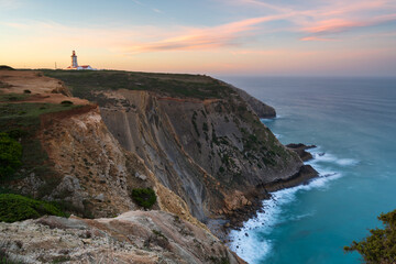 Fototapeta na wymiar Cabo Espichel cape at sunset with sea cliffs and atlantic ocean landscape, in Portugal