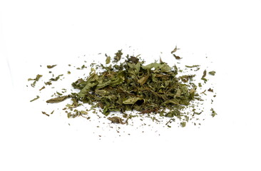Dried mint herb isolated on white background. A handful of dried mint leaves. 