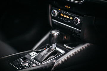 Fototapeta na wymiar The gear shift lever in the modern car, close up shot