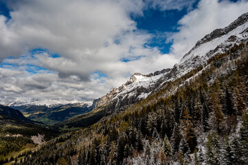 Obraz premium Winter landscape of snow covered mountains, green valley and trees. Glaciers 3000, Diablerets in Switzerland.