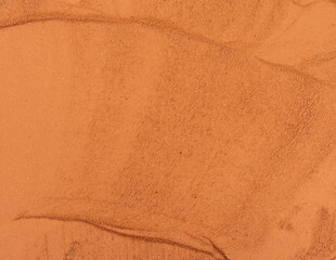  Red dry clay  surface. Ochre, also spelled ocher, a natural yellow earth pigment. Red dirt (soil)...