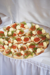 Sandwiches with caviar and butter on the festive table