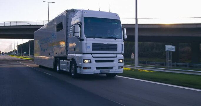 hydrogen fueled truck on the road drinving. h2 combustion Truck engine for emission free ecofriendly transport.