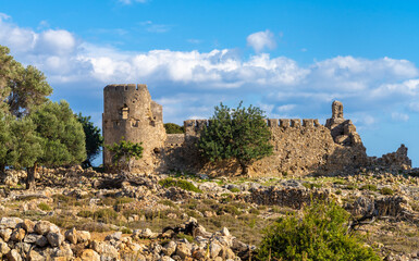 Ruins of the venetian Loutro fortress on hiking path to the rremote esort village of Loutro in the...