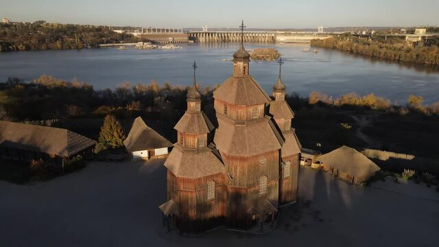 Khortytsya, Zaporozhye Sich drone, Dnipro Hydroelectric Power Plant, dam. 
Old church on the island of Khortitsa. Zaporozhye drone, Zaporizhia, Ukraine, over the dam.