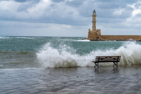 Chania lighthouse at the entrance to the stunning old venetian harbor. Chania, the second largest city of Crete, Greece