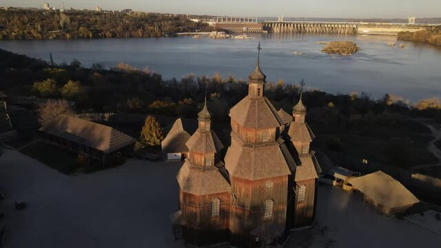 Khortytsya, Zaporozhye Sich drone, Dnipro Hydroelectric Power Plant, dam. 
Old church on the island of Khortitsa. Zaporozhye drone, Zaporizhia, Ukraine, over the dam.