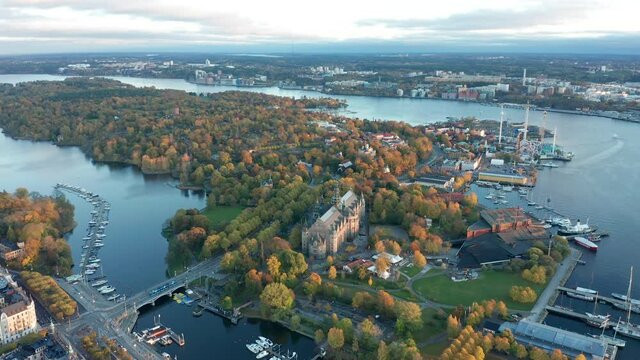 Aerial drone shot footage of Djurg&aring;rden during fall season. Nordiska Museet in Stockholm.